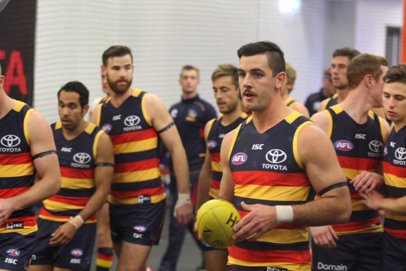 Adelaide FC captain Tex Walker will lead his team out to the AFL Grand Final